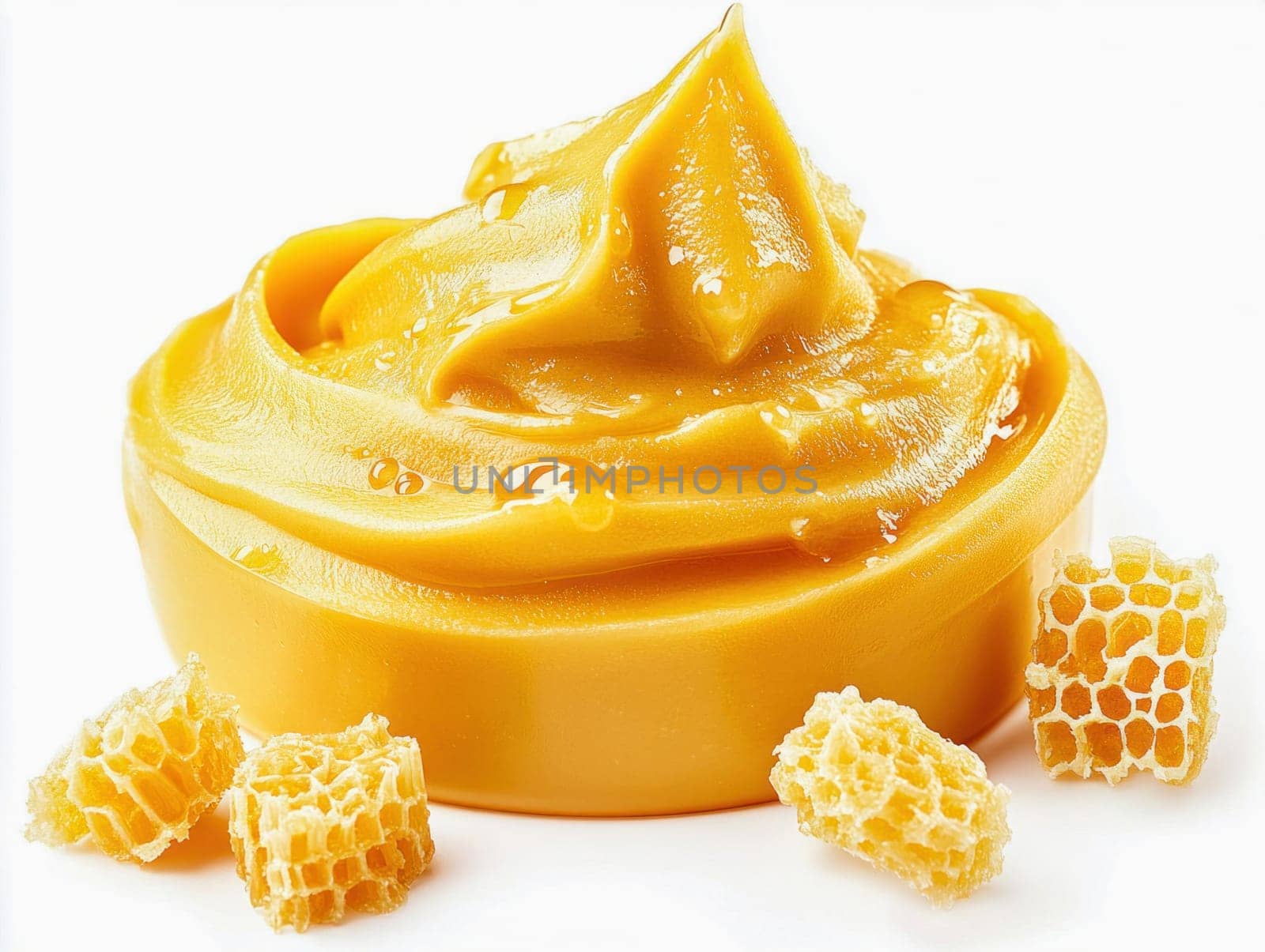 Delicious and creamy honey swirling in a bowl next to honeycomb pieces, creating a tempting image for honey lovers