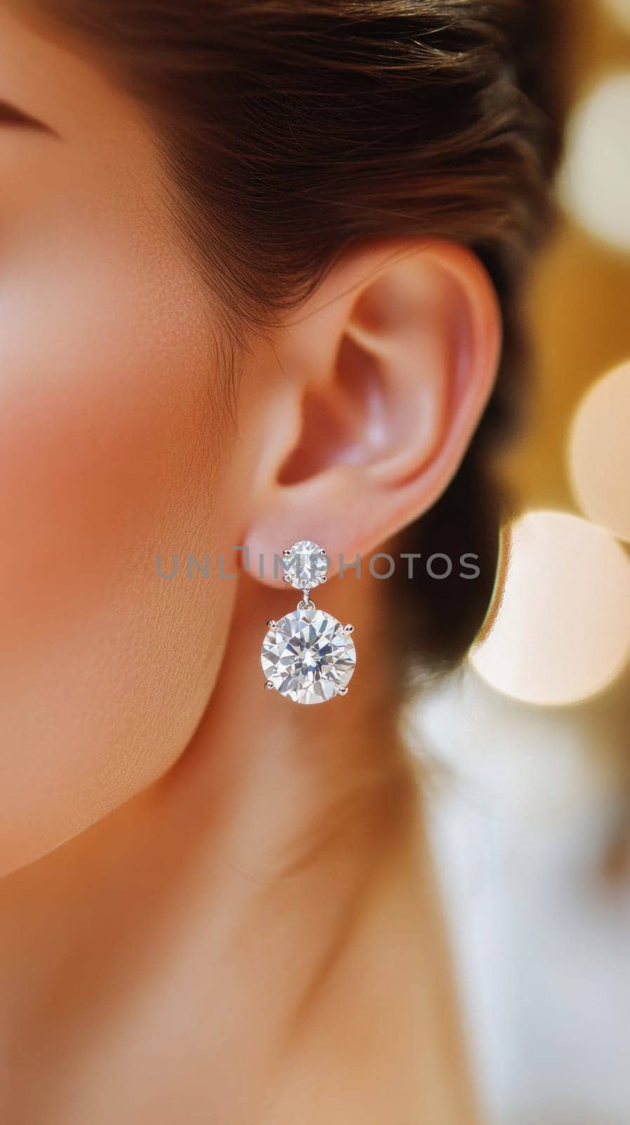 Close up of a woman wearing beautiful, sparkling diamond earrings, highlighting elegance and luxury