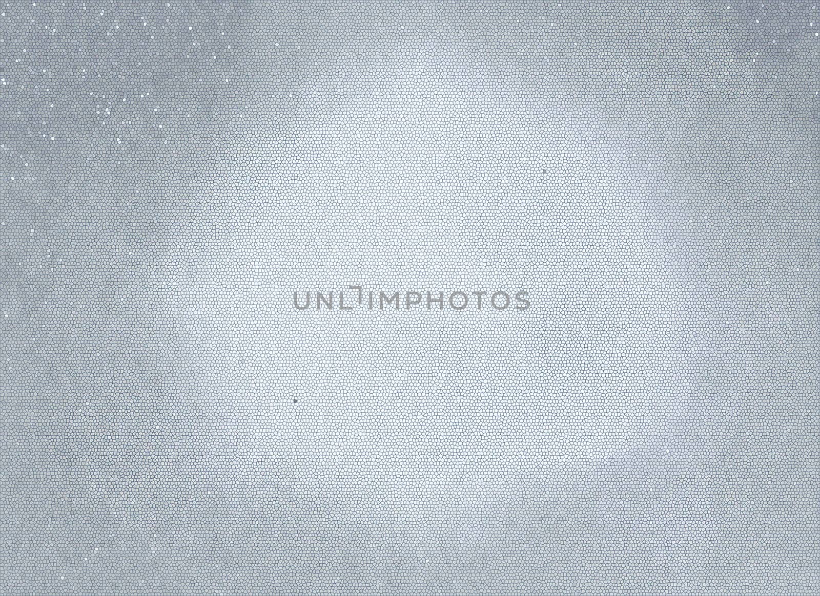 Abstract gray background with a light flare in the center of the frame and microcracks on the surface with white and black dots
