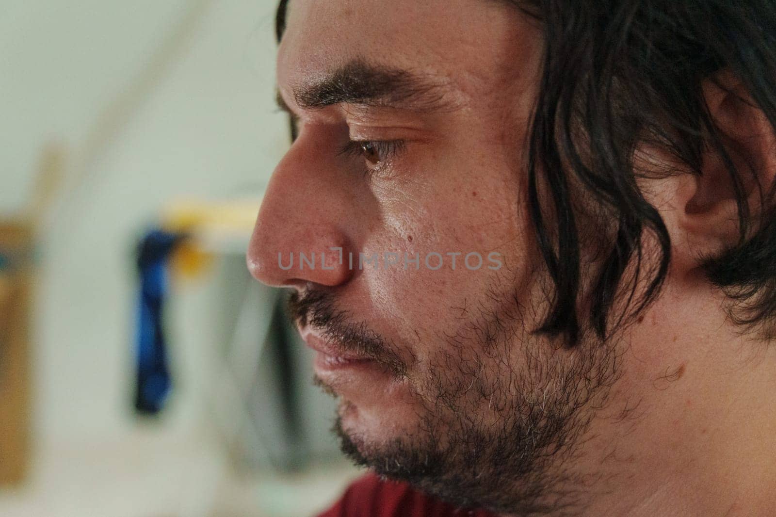 A contemplative moment captured in a bustling urban setting during a vibrant community event