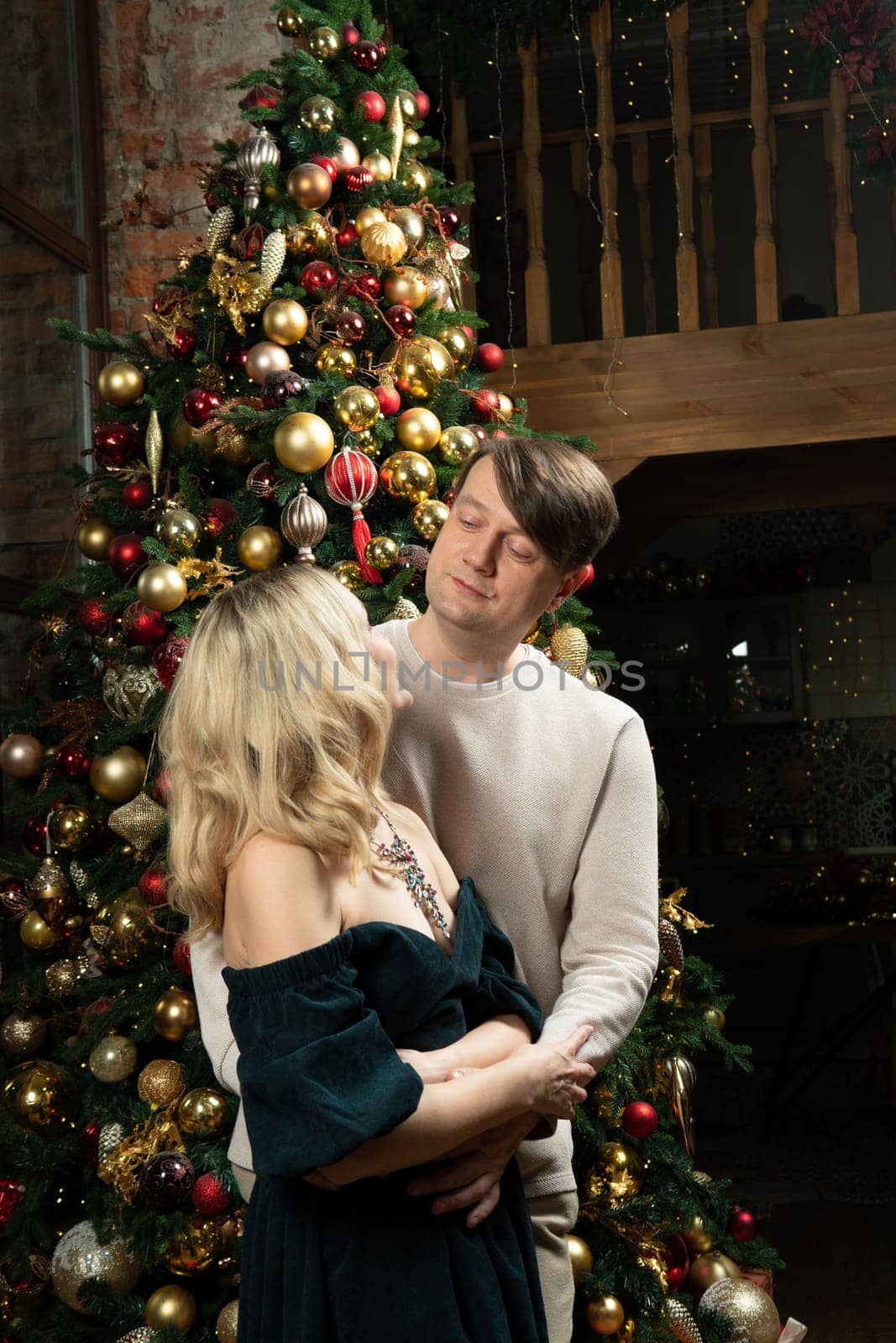 family joy decoration christmas woman celebration happiness man tree december winter smiling