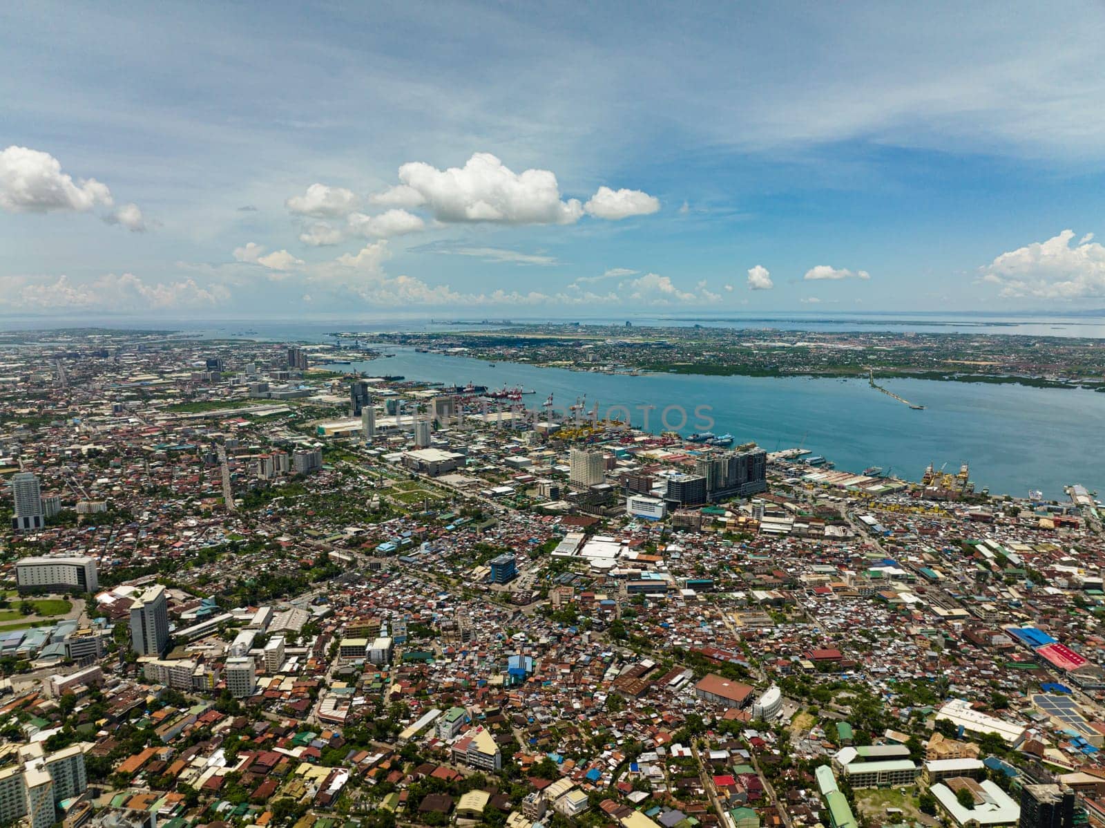 Aerial drone of Cebu city with port, modern buildings and business districts. Philippines.