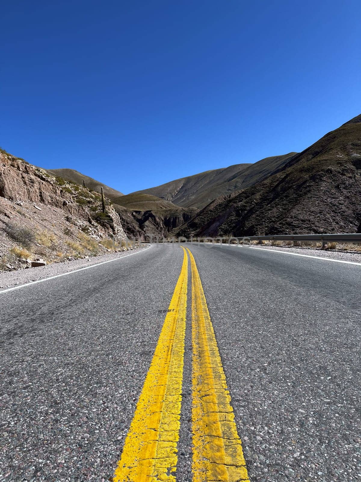 Tourism in Jujuy in a sunny winter day. Tourism in the north of Argentina. Winter holidays in Argentina. Background for tourism promotions and brochures. Concept of mountain tourism