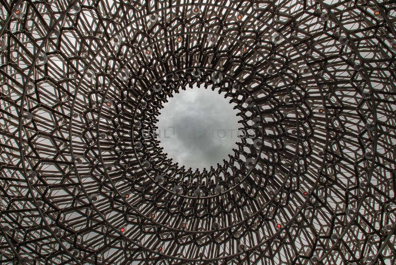 London, UK - Apr 9, 2019 : Detail on the center of the intricate structure under a clear sky, It is called "The Hive" Designed by Artist Wolfgang Buttress.