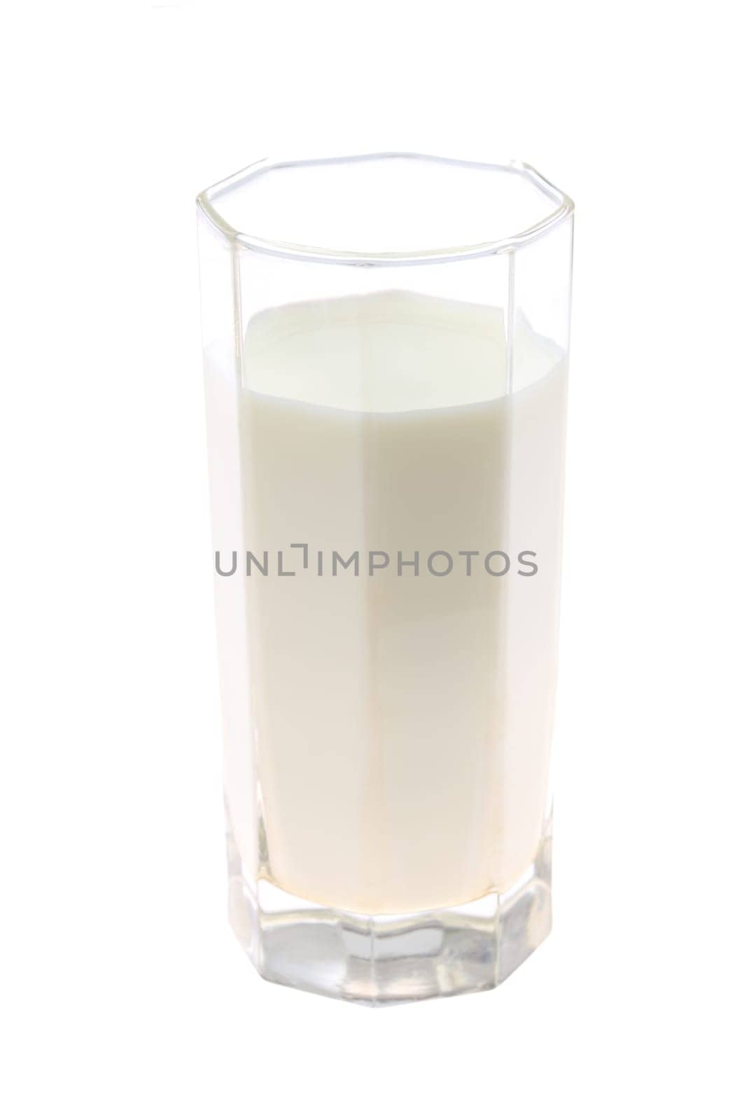 A clear glass that is filled to the brim with fresh, creamy, and delicious milk, perfect for health and nutrition