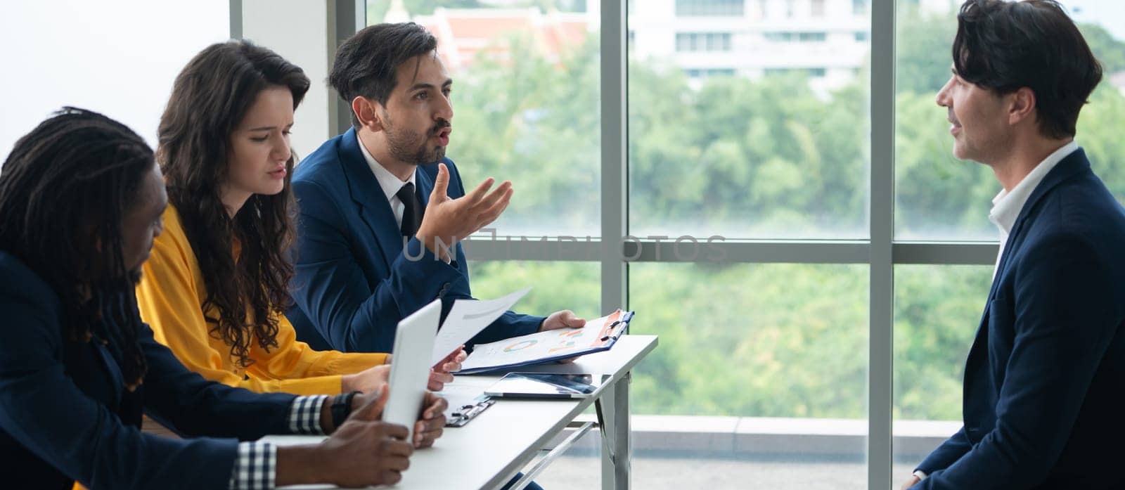 Diversity recruiters interview candidate at the bright office. A group of human resources professionals explaining an applicant for a new position. asking interviewee a question. Intellectual.