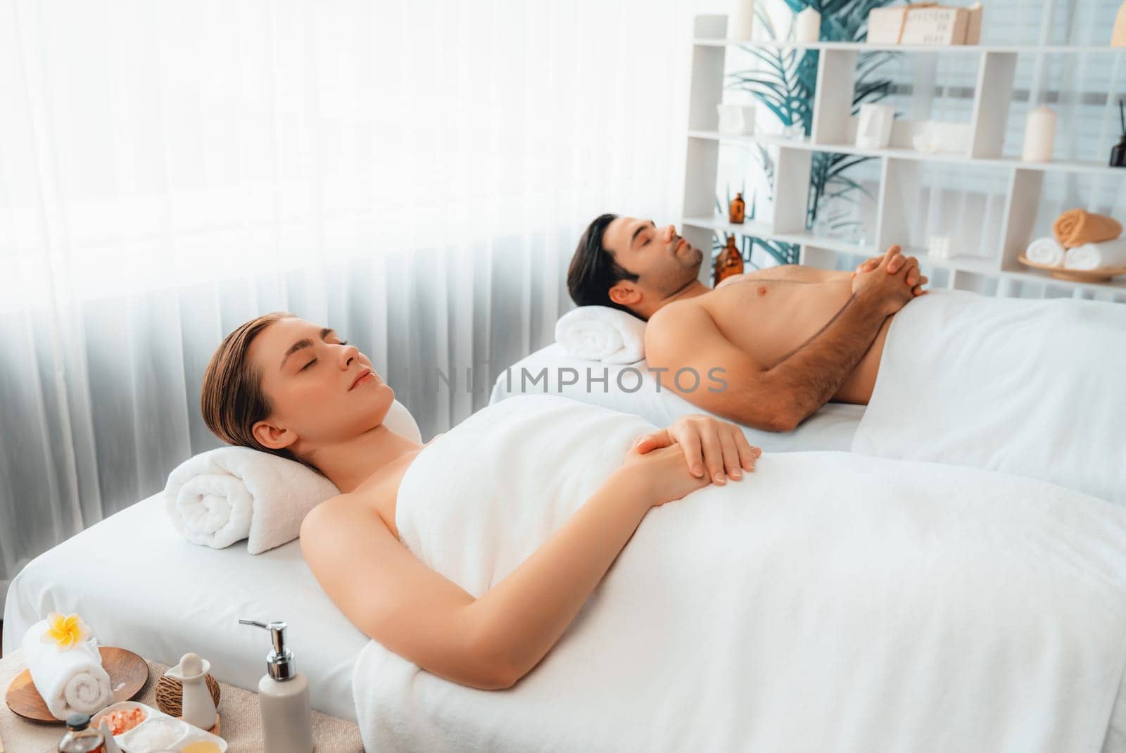 Caucasian couple customer enjoying relaxing anti-stress massage. Quiescent by biancoblue