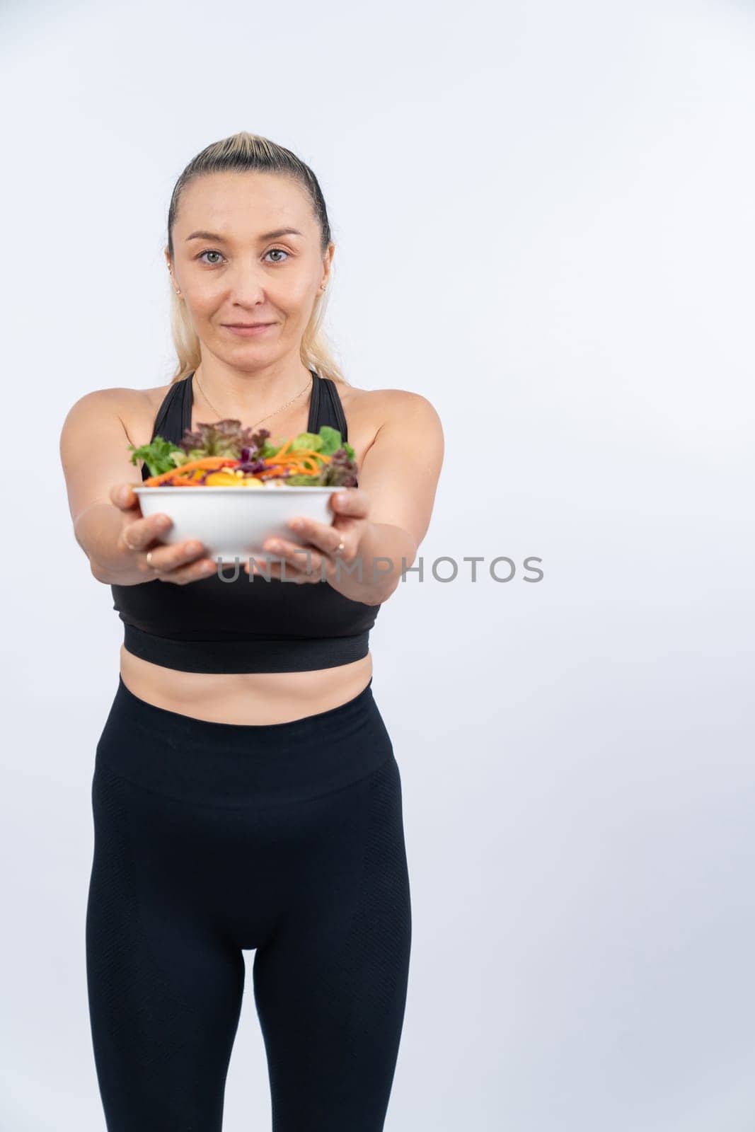 Happy smile senior woman portrait holding bowl of vegan fruit and vegetable on isolated background. Healthy senior people with healthy vegetarian nutrition and body care lifestyle. Clout