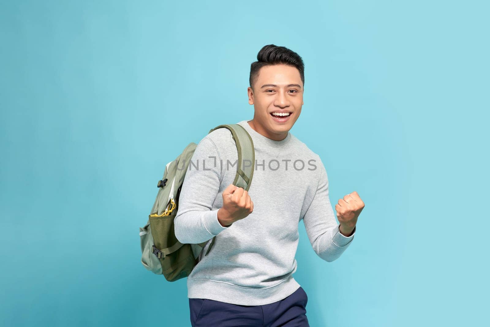 Winner man. Happy guy shows "Yes" gesture. Concept of luck success victory triumph