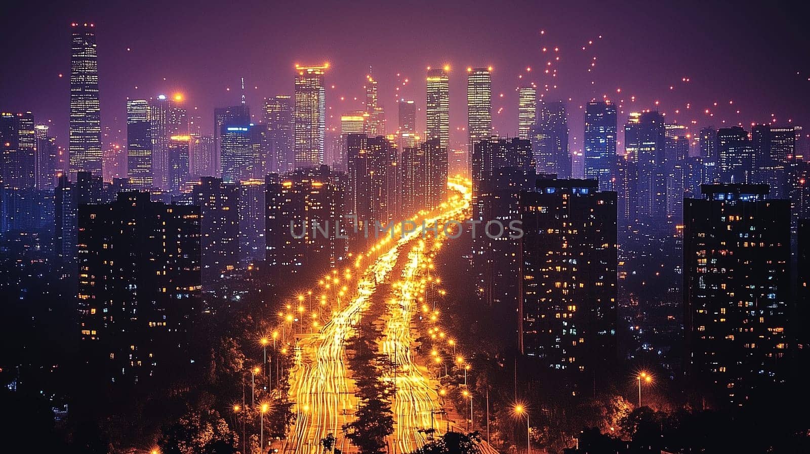 Bright lights illuminate a bustling city skyline at night. Towering buildings stand tall while traffic flows along a wide road, creating a dynamic city atmosphere.
