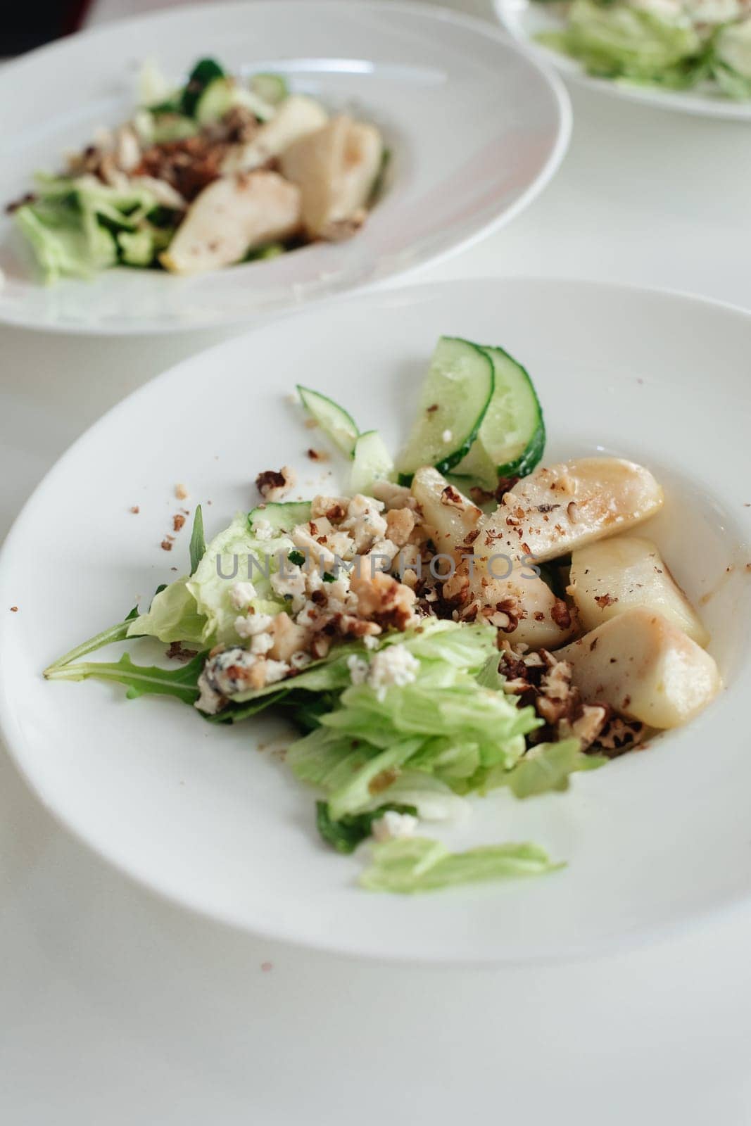 Salad with blue cheese, pears, nuts, chard and arugula.