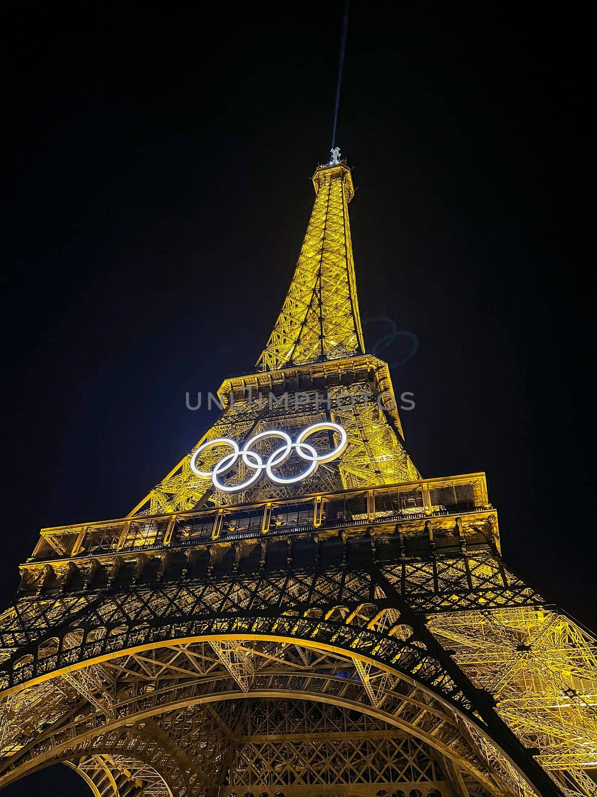 Paris, FRANCE - October 2024: The Olympic Rings installed on the Eiffel Tower ahead of the Paris 2024 Olympic Games, High quality photo