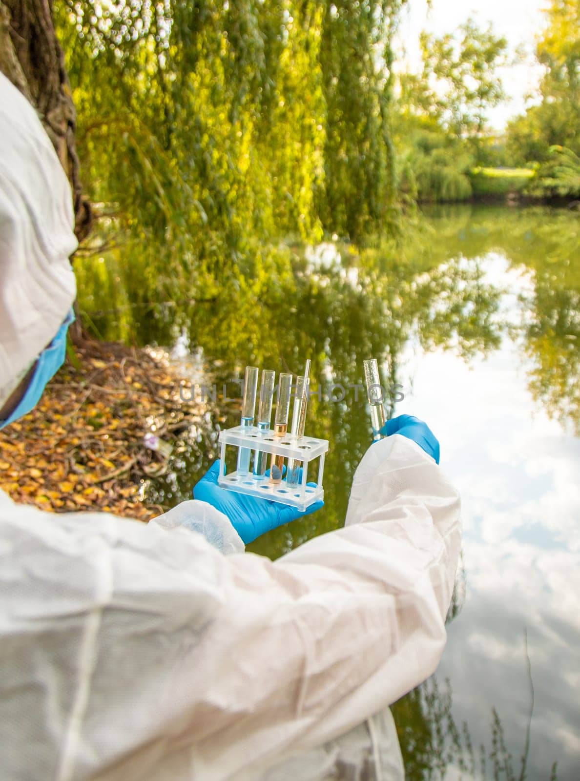 Take water samples for analysis. Selective focus. nature.