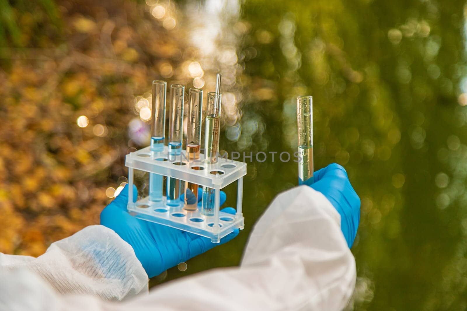 Take water samples for analysis. Selective focus. nature.