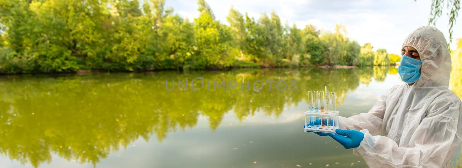 Take water samples for analysis. Selective focus. nature.