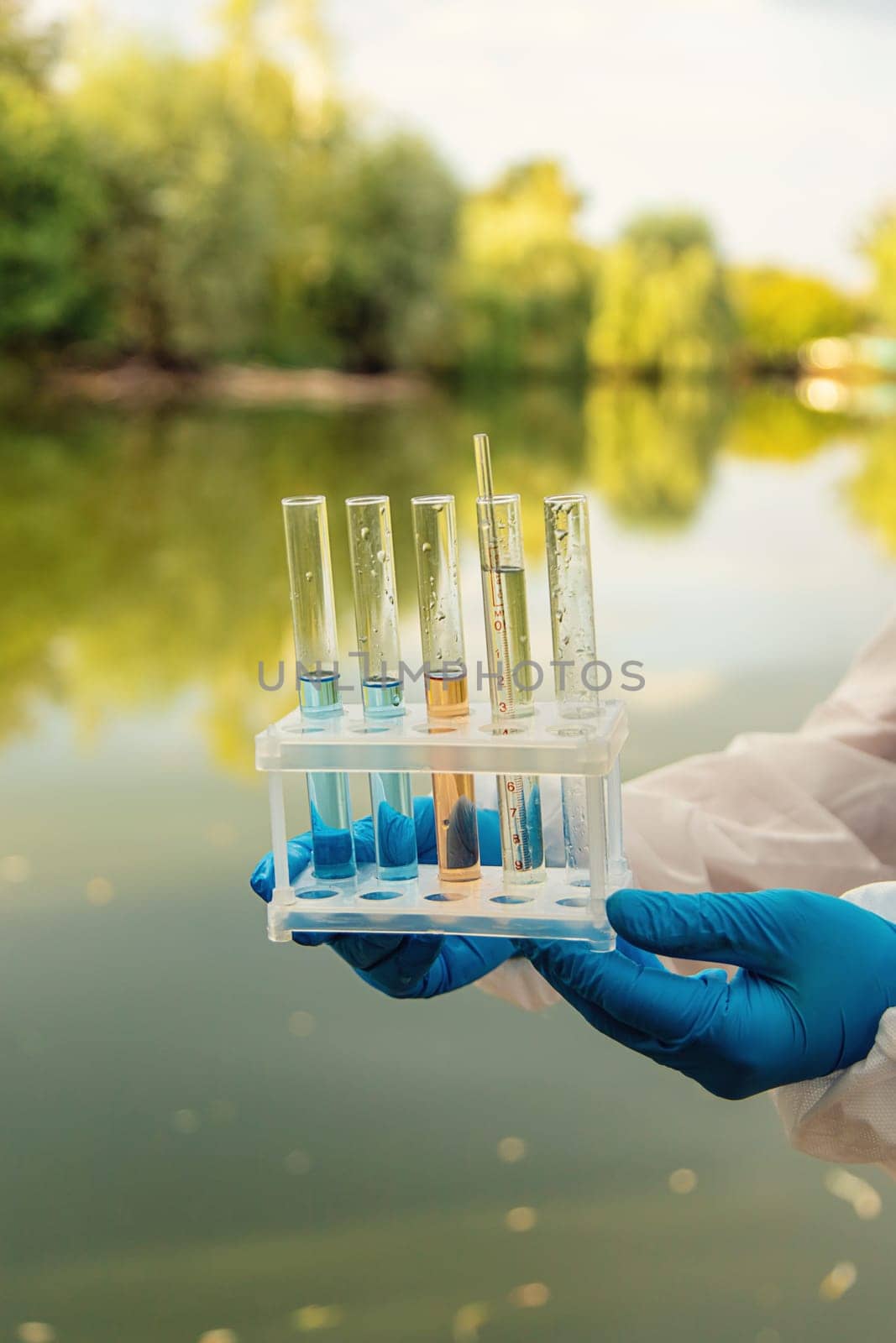 Take water samples for analysis. Selective focus. nature.