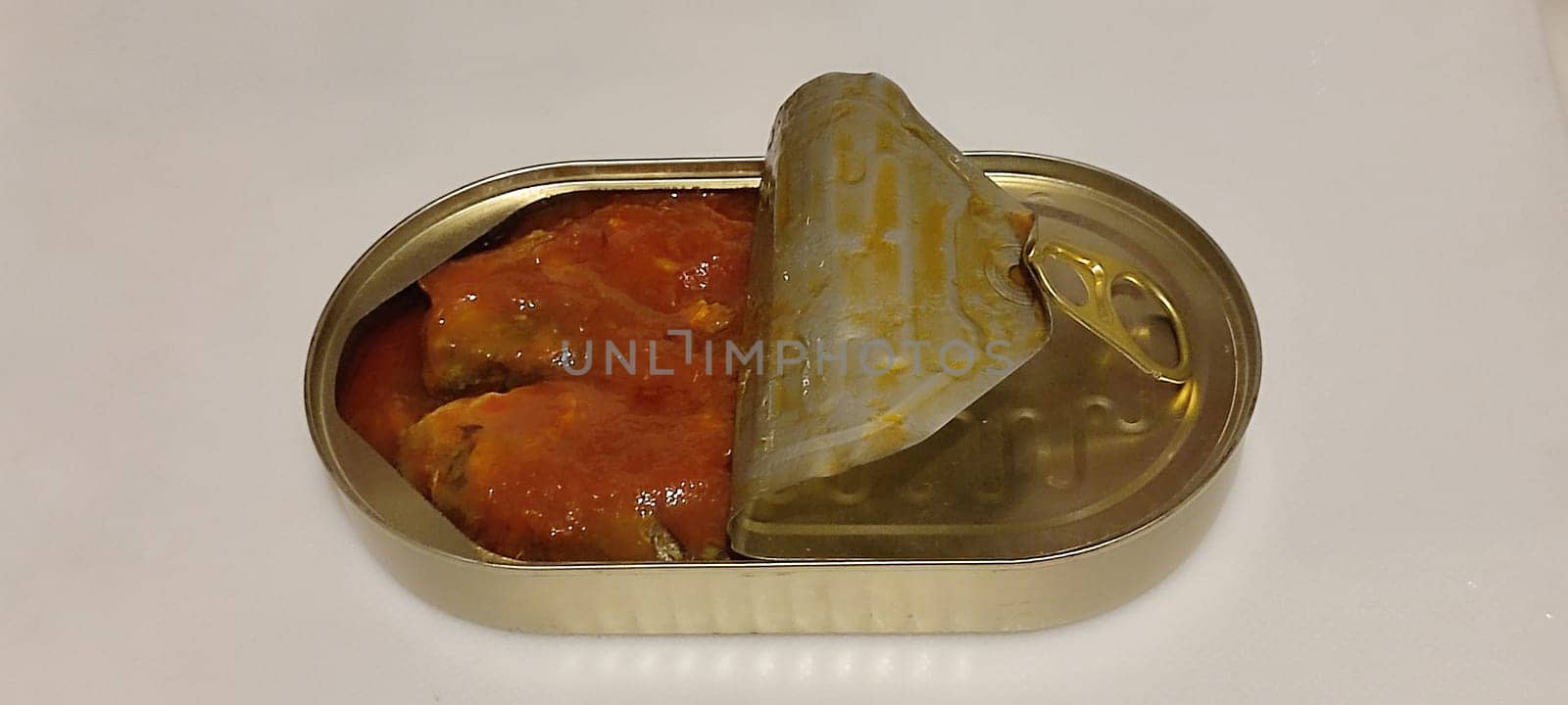 metal can fish in tomato sauce, isolated object, white background. High quality photo