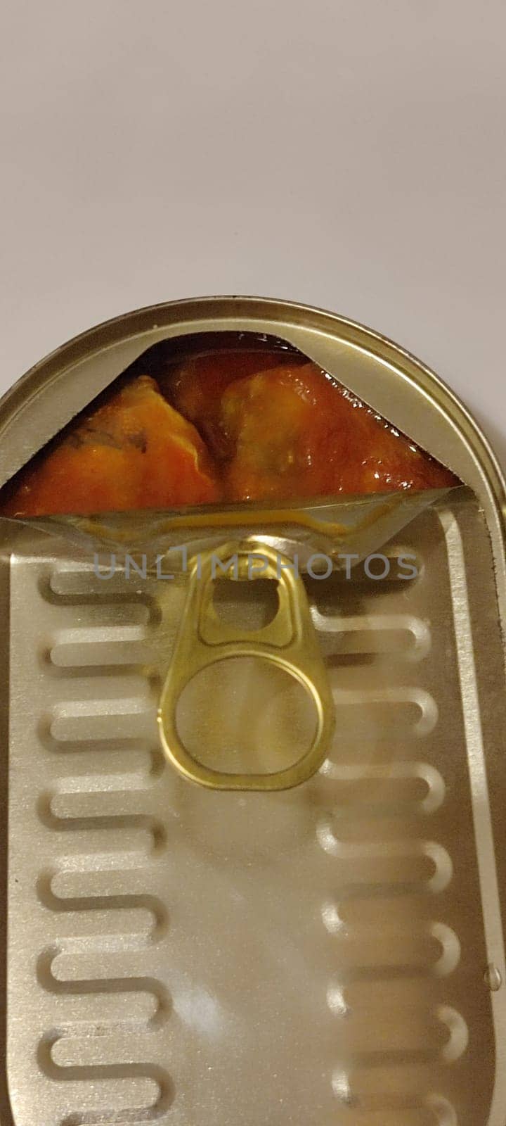 metal can fish in tomato sauce, isolated object, white background. High quality photo