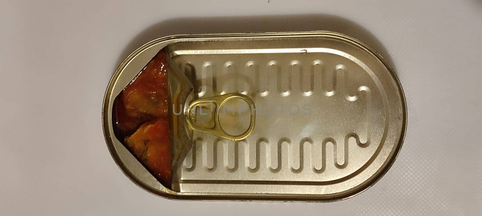 metal can fish in tomato sauce, isolated object, white background. High quality photo