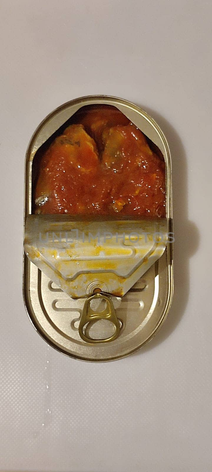 metal can fish in tomato sauce, isolated object, white background. High quality photo