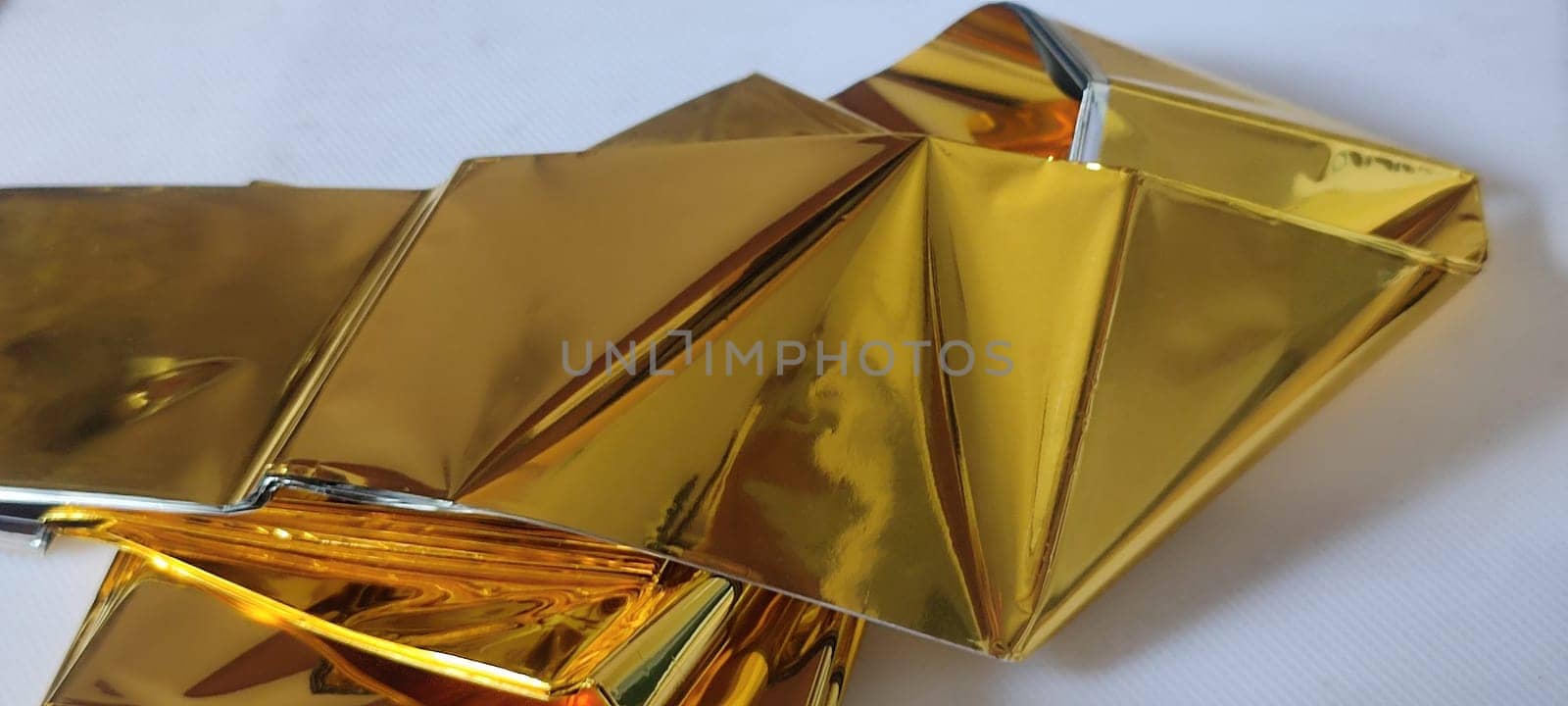 thin gold foil aluminum blanket background AliExpress souvenir texture, emergency blanket, abstract object on white background