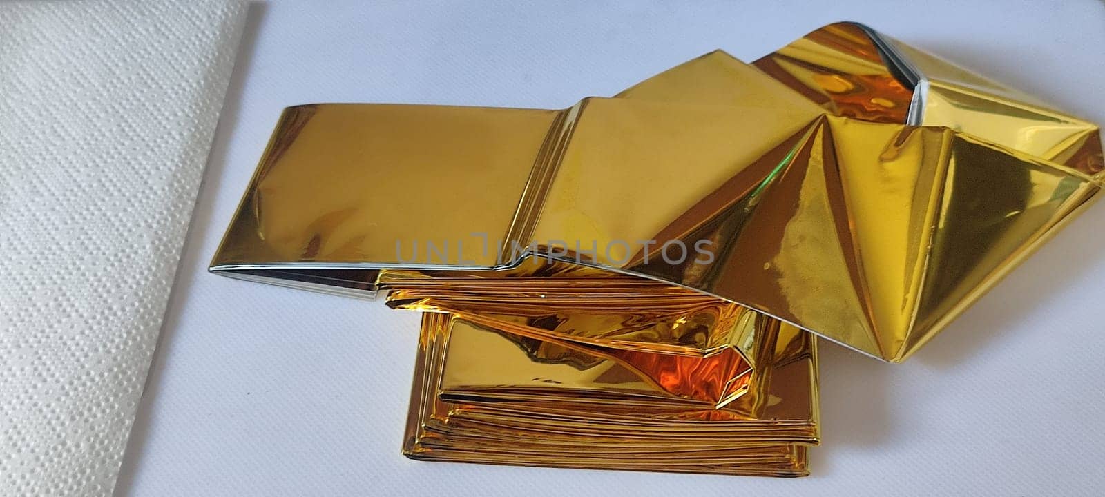 thin gold foil aluminum blanket background AliExpress souvenir texture, emergency blanket, abstract object on white background