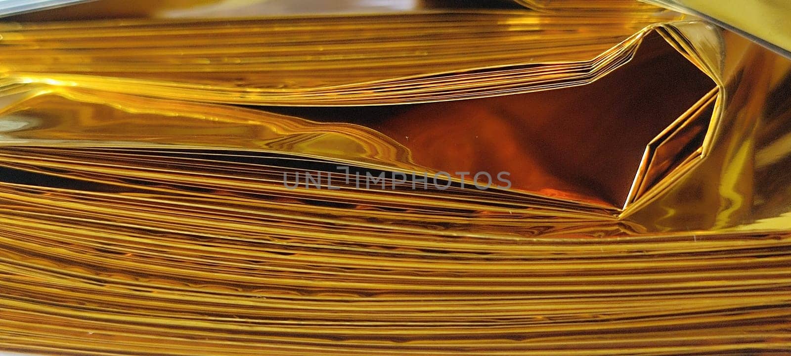 thin gold foil aluminum blanket background AliExpress souvenir texture, emergency blanket, abstract object on white background