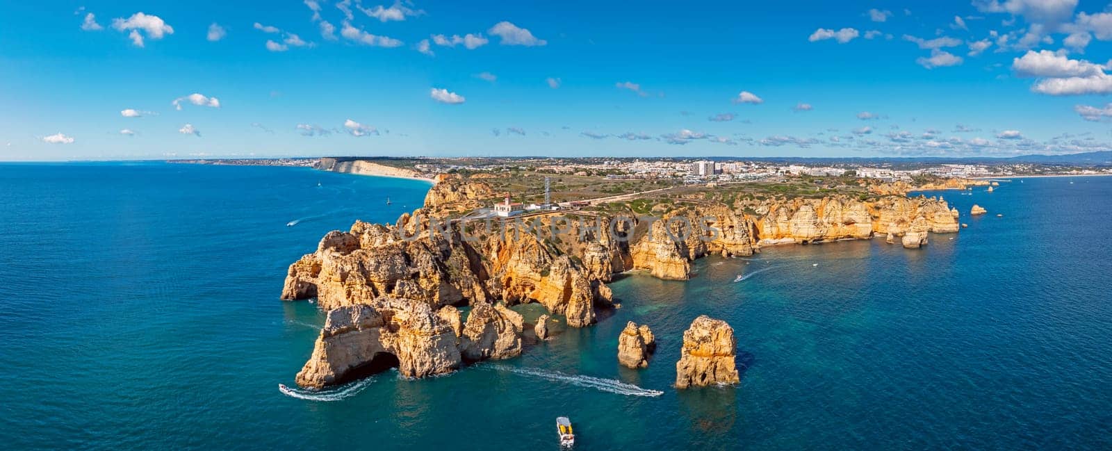 Aerial panorama from the natural rocks at Ponte Piedade with the lighthouse in Lagos Portugal