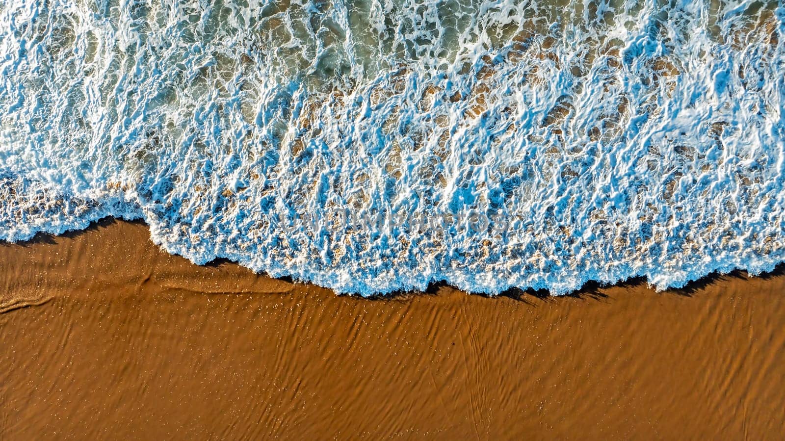 Aerial topshot from ocean waves at the atlantic ocean