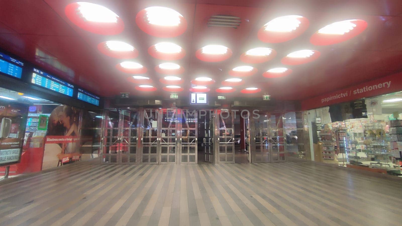 October 23 2024, Prague Czech Republic Europe, escalator at the city railway station, transport, traffic, industry, red color ceiling with lamps. High quality photo