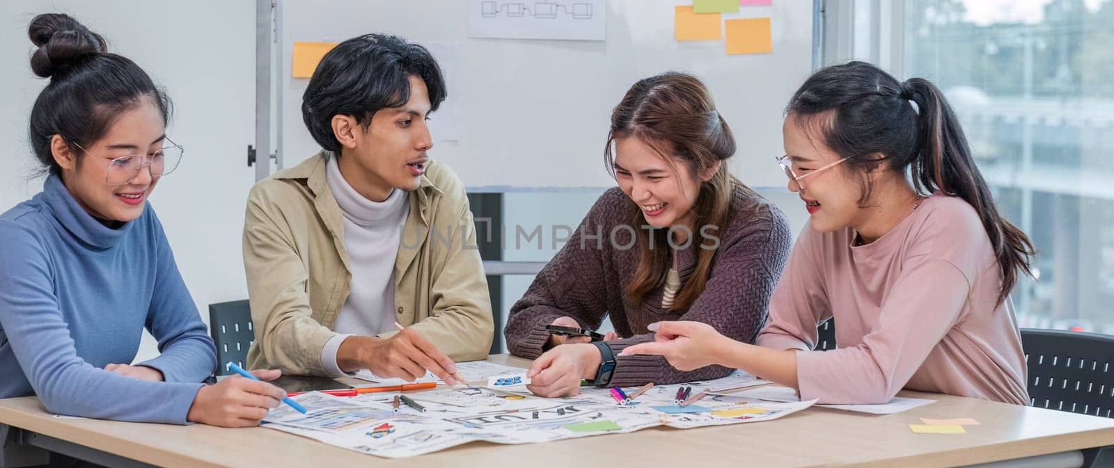 Asian office team brainstorming, plan for solution idea, Group of asia creative teamwork and woman leader at business meeting for developing mobile phone app, ux, ui start up, small business.