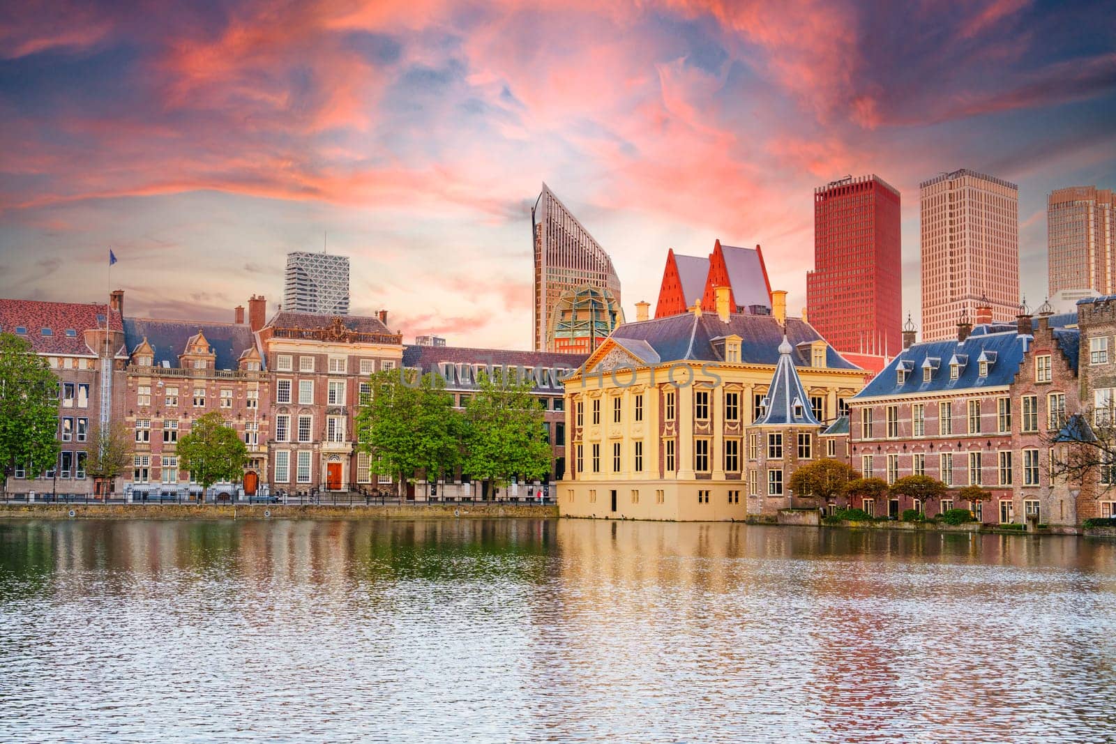 The Hague, Ridderzaal in Binnenhof with the Hofvijver lake at sunset. Meeting place of States General of the Netherlands, the Ministry. Office of the Prime Minister of Netherlands.