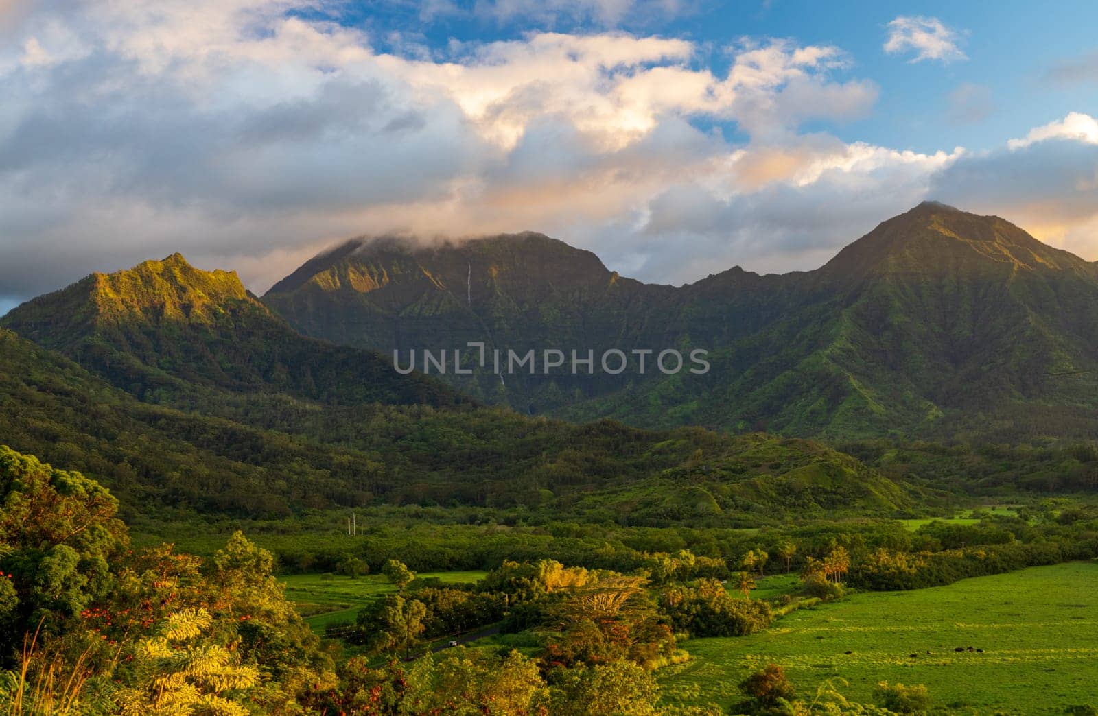 Sunset over the mountains around Hanalei Bay on Kauai by steheap