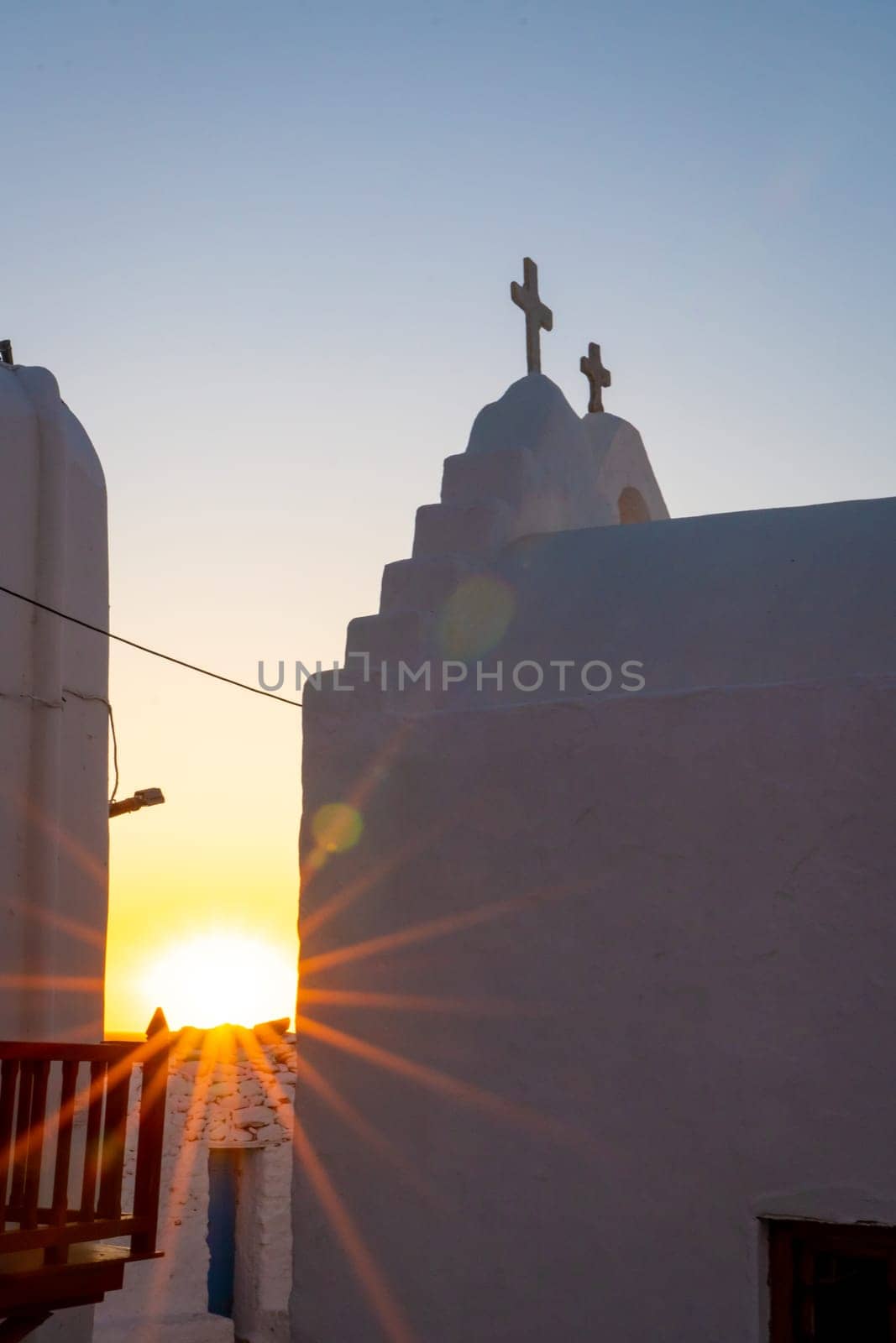 Sunbeams on the Panagia Paraportiani church at sunset