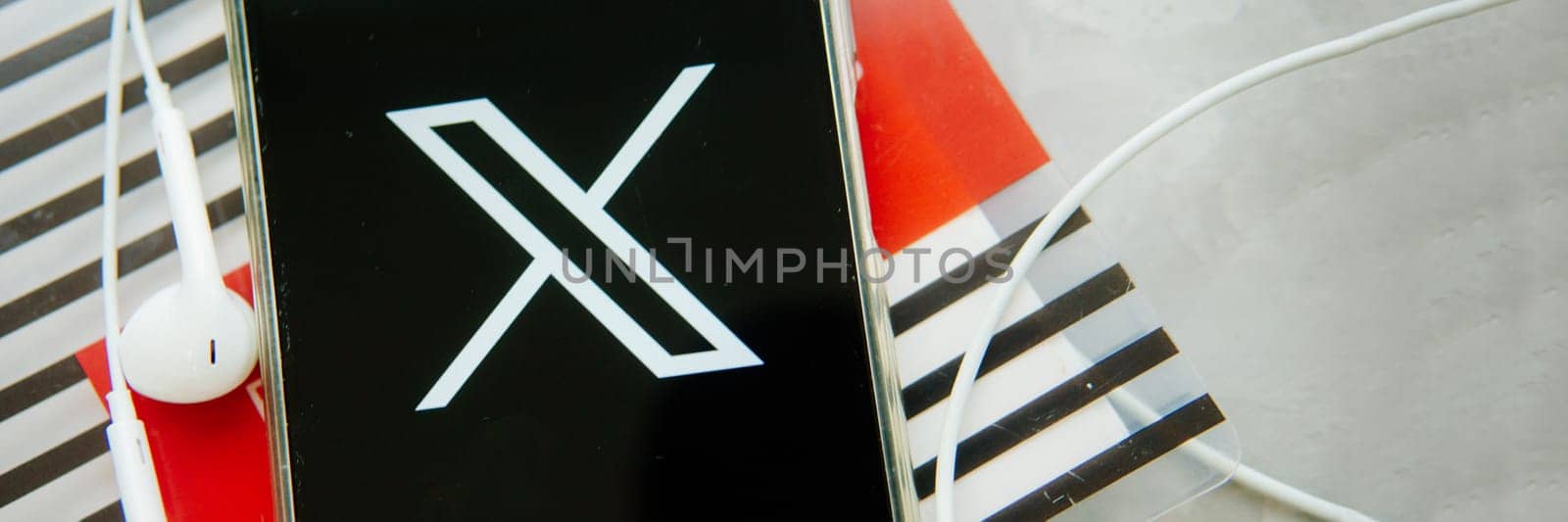July 25, 2023, Russia. The logo in the form of the letter X displayed on the smartphone. Twitter rebranding, and implementation of X