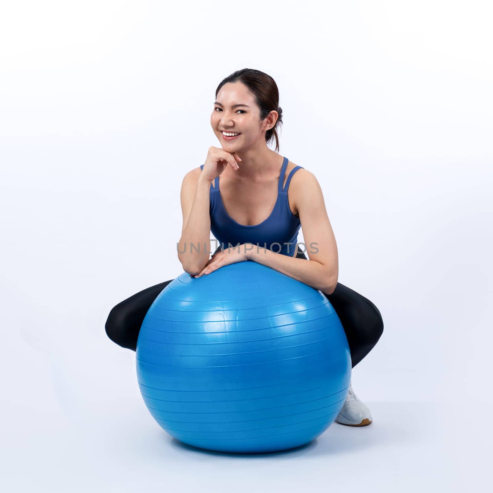 Young attractive asian woman portrait in sportswear with fit ball. Vigorous by biancoblue