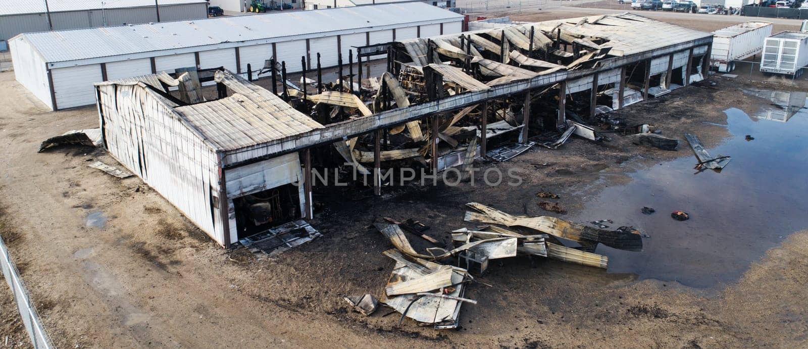 A building has been destroyed by fire. The fire has caused a lot of damage to the building and the surrounding area