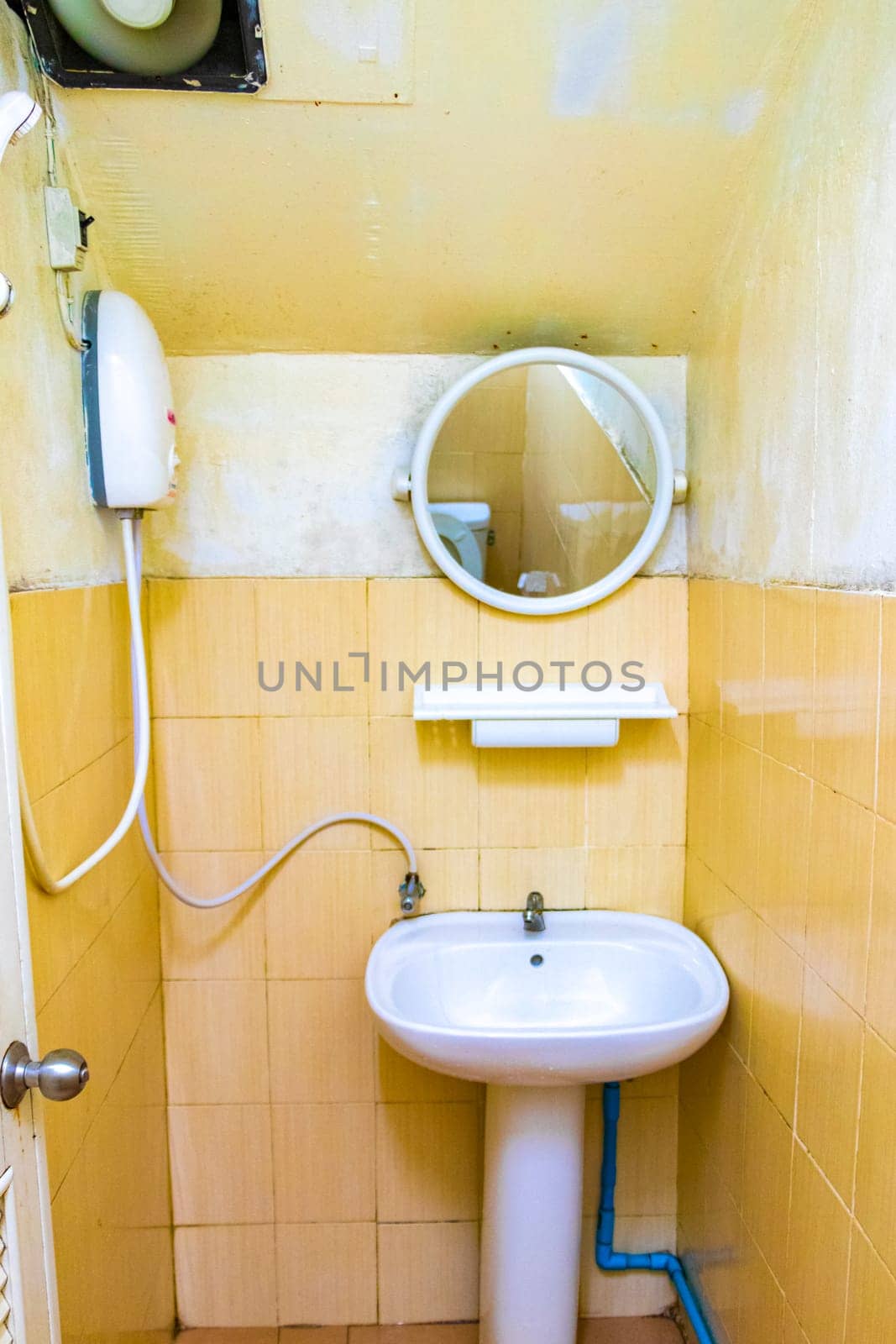 Cheap and dirty hotel room toilet on Koh Phi Phi Don island in Ao Nang Amphoe Mueang Krabi Thailand in Southeast Asia.