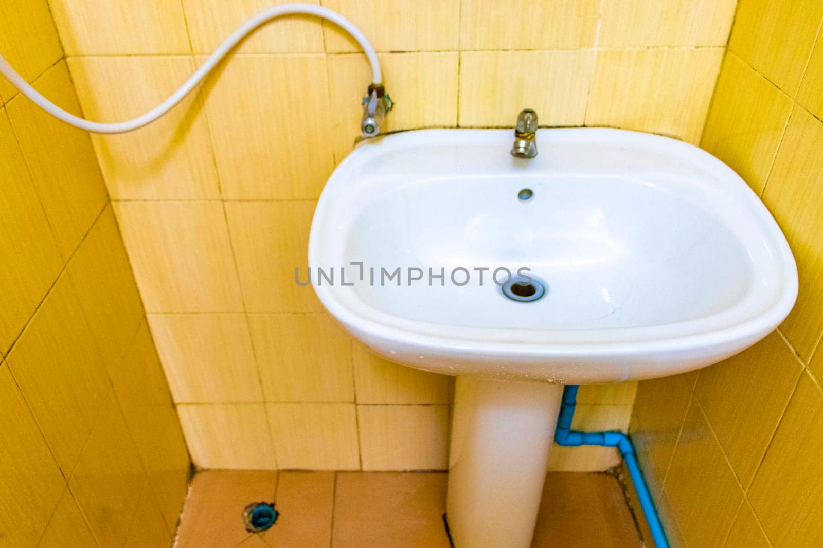 Cheap and dirty hotel room toilet on Koh Phi Phi Don island in Ao Nang Amphoe Mueang Krabi Thailand in Southeast Asia.