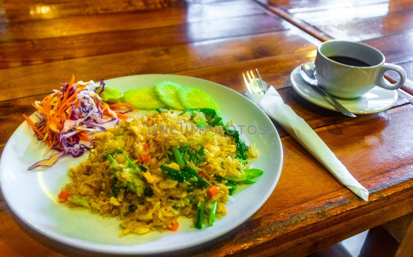 Street food fried rice and a cup of coffee in restaurant on Koh Phi Phi Don island in Ao Nang Amphoe Mueang Krabi Thailand in Southeast Asia.