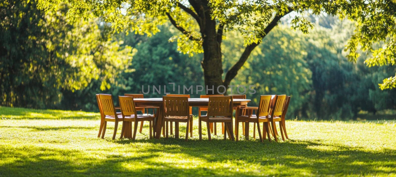 Inviting outdoor dining setting beneath a shady tree, perfect for summer gatherings and relaxation