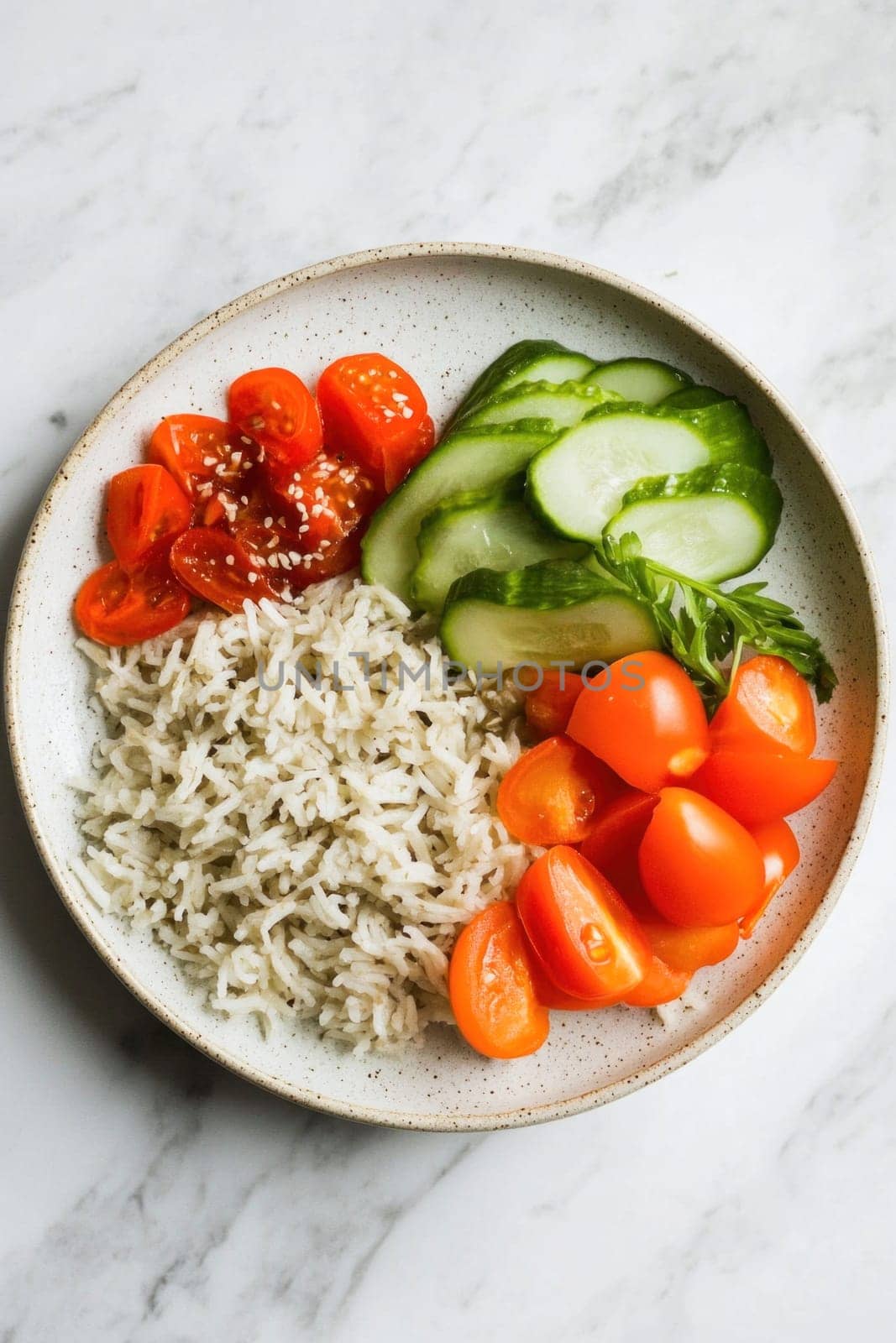 Delicious and nutritious vegan meal featuring rice, cucumber, and cherry tomatoes in a bowl, promoting healthy eating and balanced diets