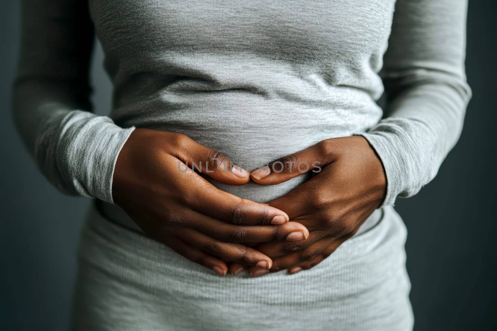 A black person with a stomach ache. holding their stomach in pain. on white background. with white space.