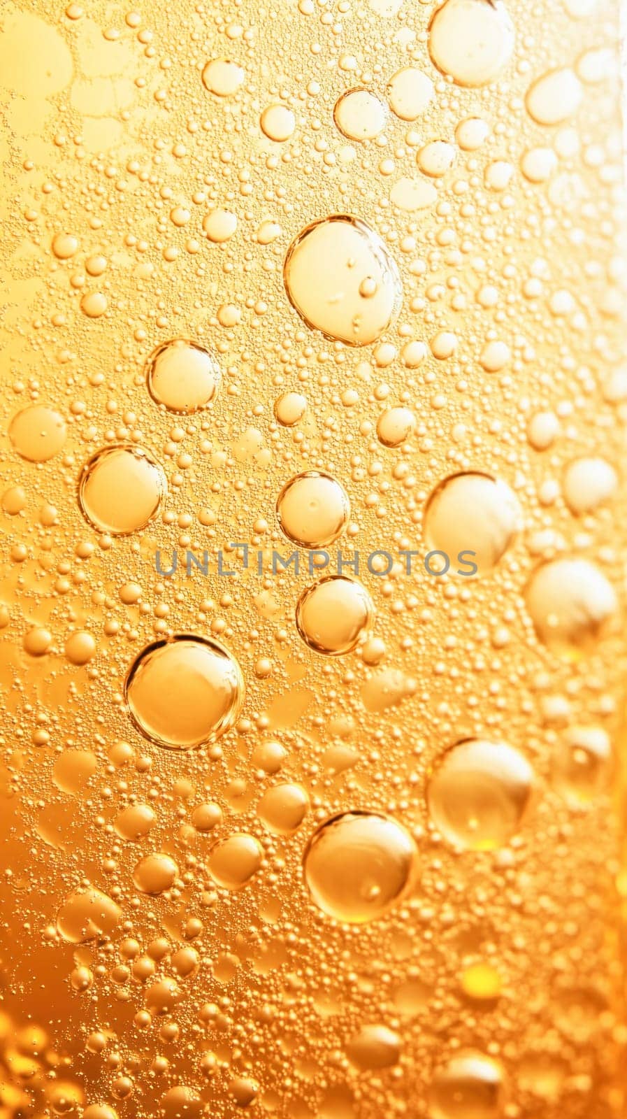 Close up of golden bubbles forming an abstract pattern, ideal for backgrounds and textures