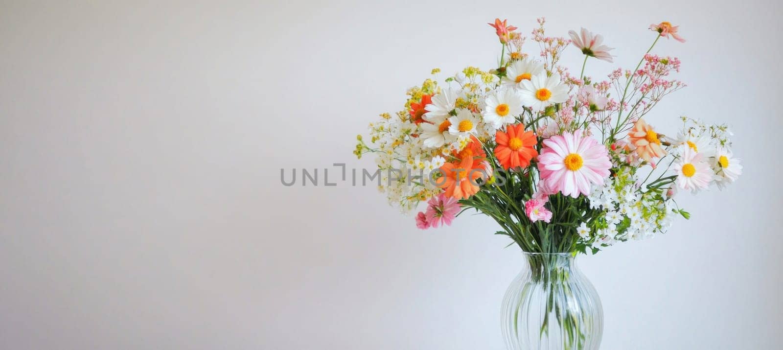 Lush bouquet of fresh cut flowers including roses, matthiola and eucalyptus, creating a spring atmosphere