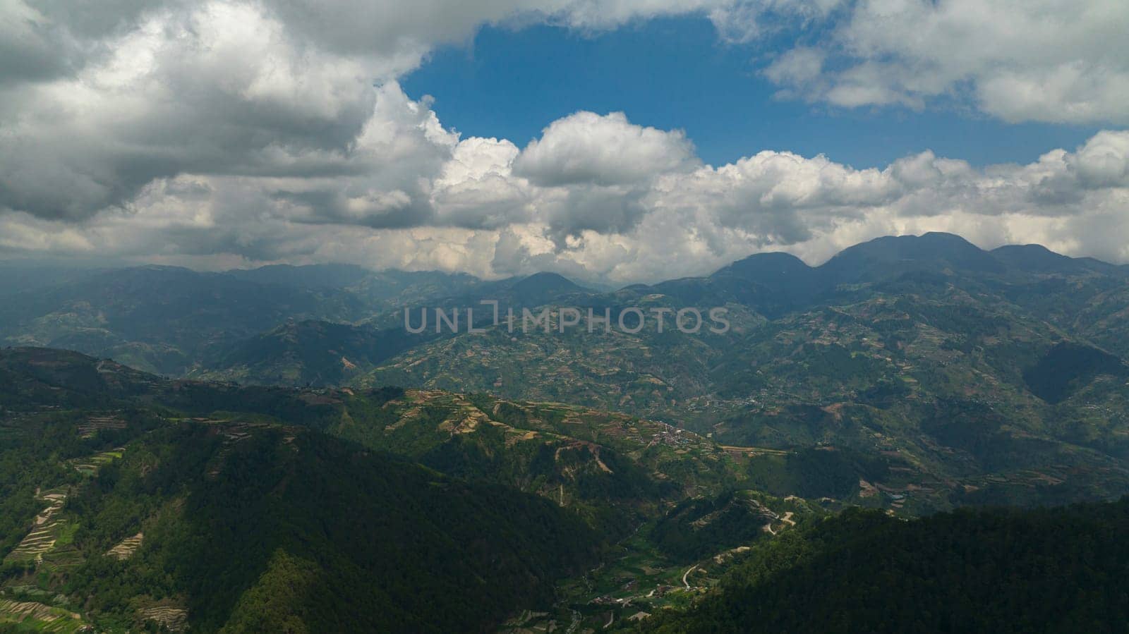 Top view of rice terraces and agricultural land on hillsides in a mountainous province. Philippines, Luzon.