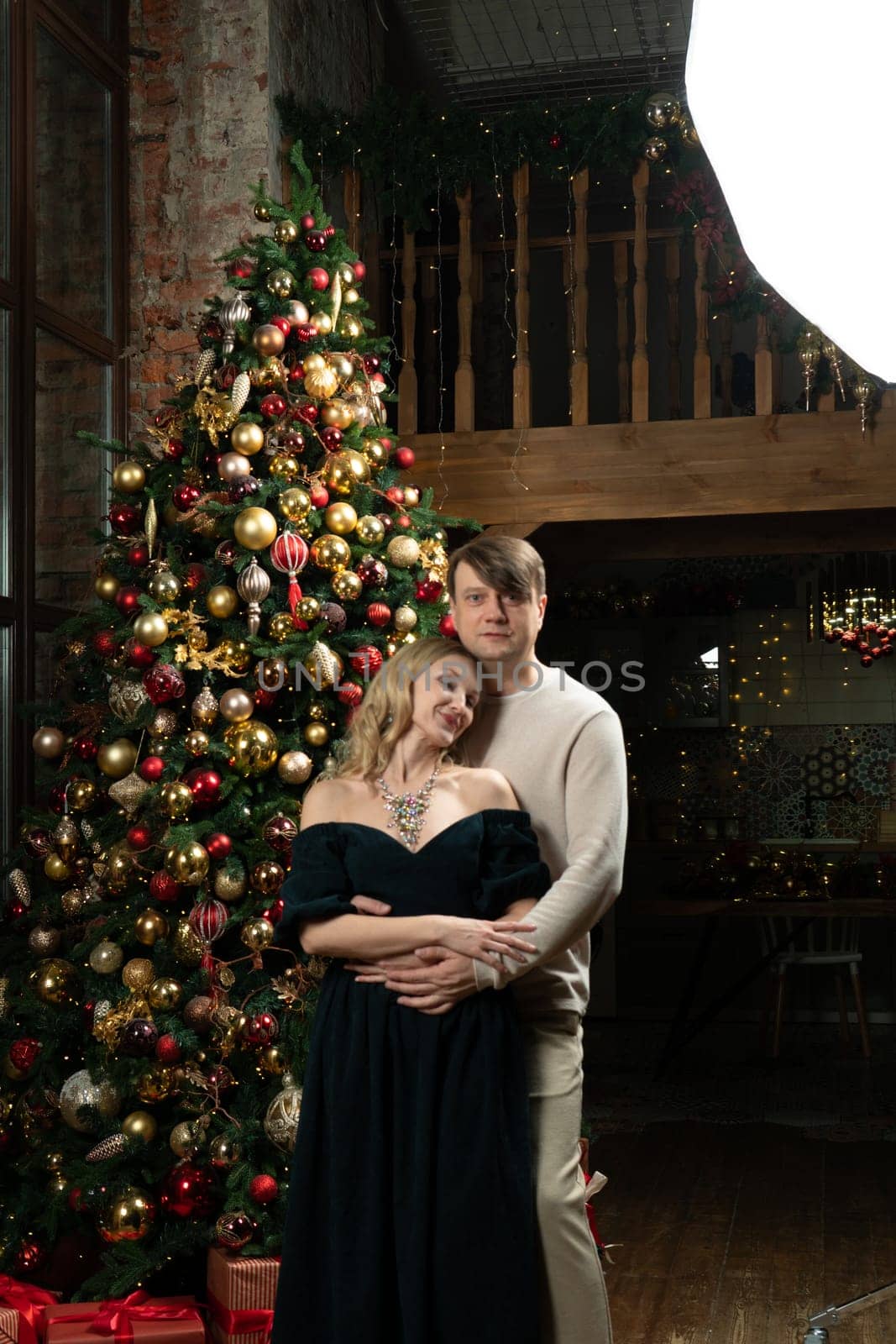 winter joy tree celebration december family christmas woman decoration man smiling happiness