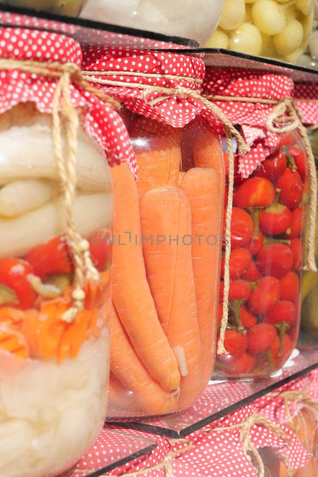 Canned fruits and vegetables in glass jars.