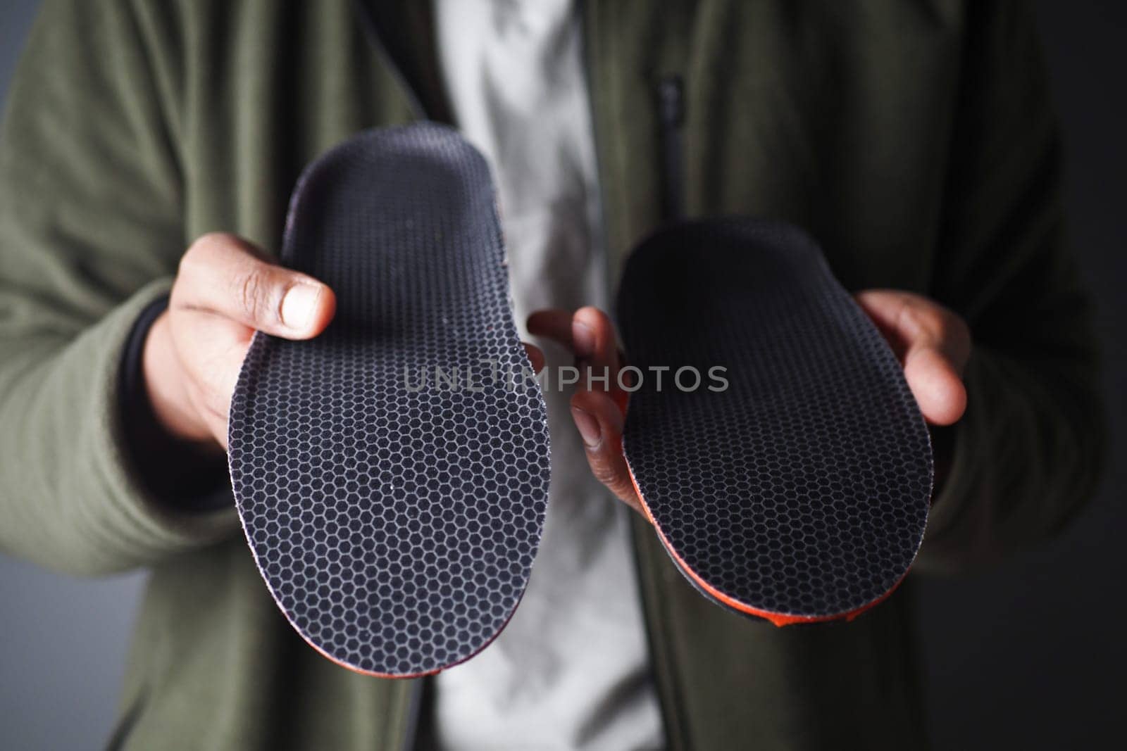 Visual comparison of two shoe insoles showcasing design and texture differences.