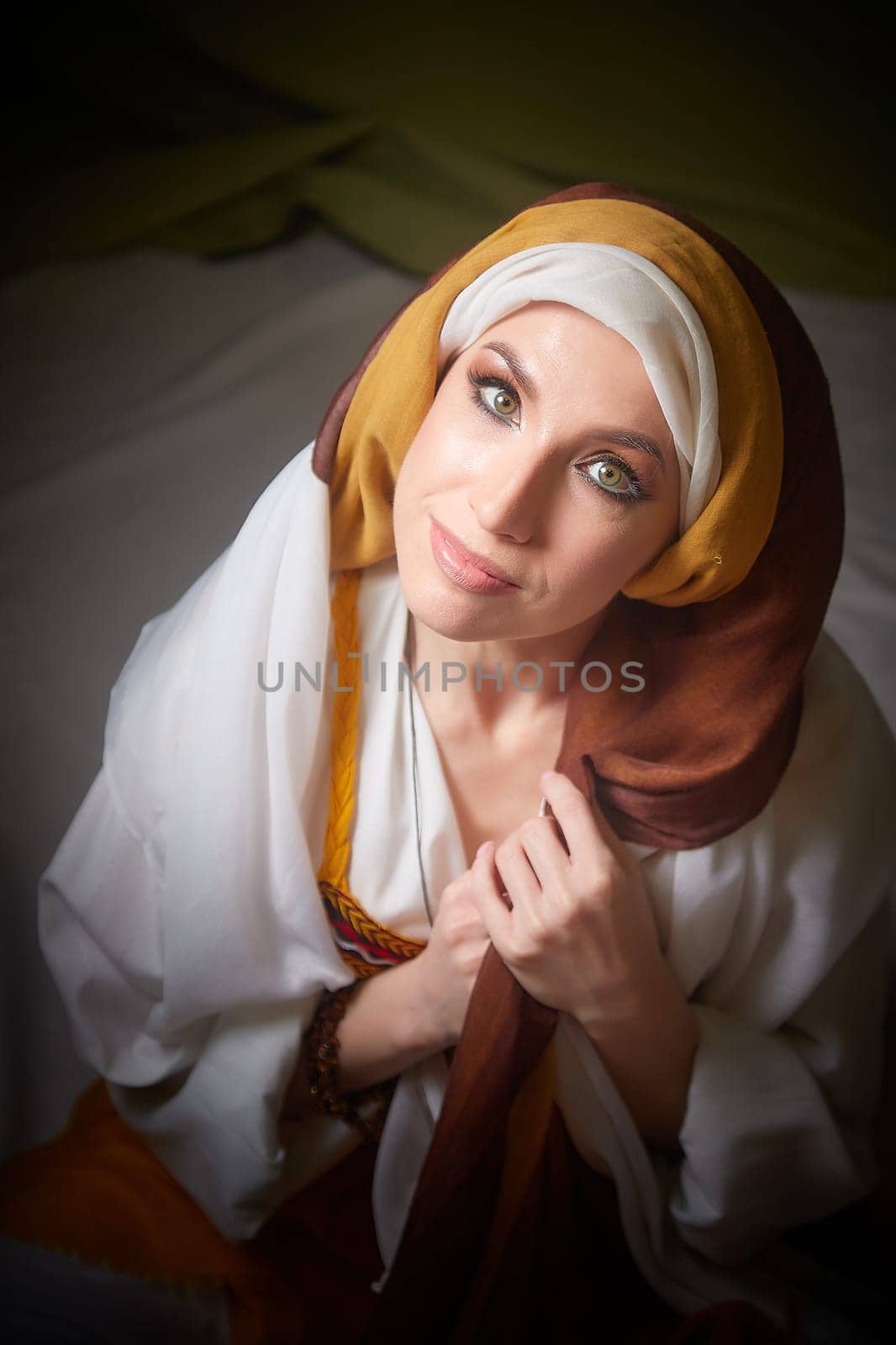 The girl embraces her heritage in stunning traditional attire, personifying Rebekah from the Christian Bible in a peaceful moment.